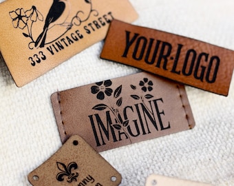 May include: Five different leather labels with various designs and text. The labels are brown and tan with black text. The text on the labels includes "333 Vintage Street", "Your Logo", "Imagine", "henny design", and a floral design.