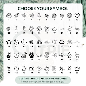 May include: A chart with 50 different symbols, including hearts, stars, flowers, animals, and other designs. The chart is labeled "Choose Your Symbol" and includes the numbers 1 through 50.