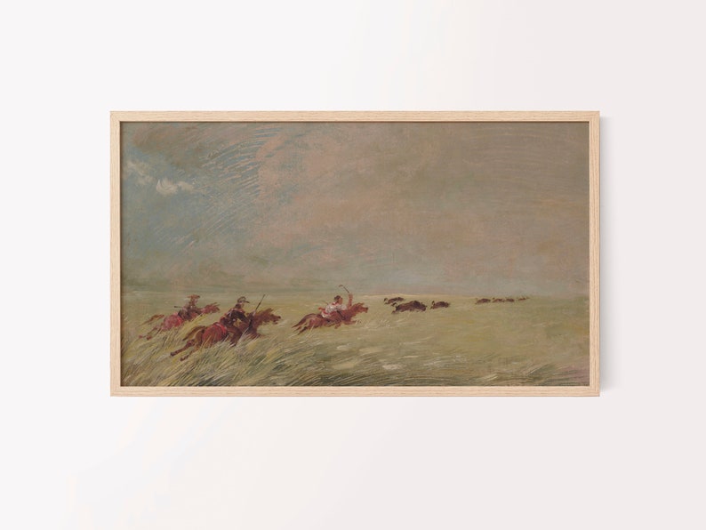 May include: An antique-style framed print depicts a historical scene of riders on horseback chasing bison across a grassy plain. The artwork features muted tones of brown, green, and gray, with a cloudy sky in the background.