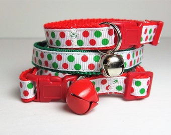 May include: Three red and green polka dot cat collars with red plastic buckles and silver bells.