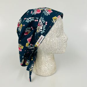 May include: A set of three ceramic mugs with a speckled, matte finish. The mugs are in shades of cream, light gray, and dark gray. Each mug has a simple, minimalist design and a rounded handle.