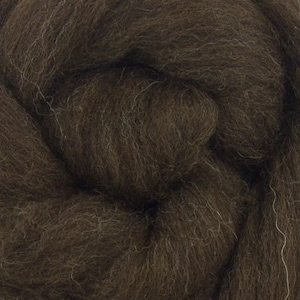 May include: Close-up of a dark brown wool roving. The fibers are tightly packed and have a soft, textured appearance. The wool is a solid color with subtle variations in tone, suggesting a natural dye or fiber. Ideal for fiber art projects.