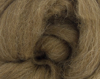 May include: Close-up of a mass of brown wool roving. The fibers are tightly packed and have a soft, textured appearance. The color is a warm, earthy tone, suitable for various crafting projects like felting or spinning.