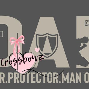 May include: Gray graphic design with the word "DAD" in large letters, a cross, a shield, and a sword. The text "LEADER. PROTECTOR. MAN OF GOD" is at the bottom. A pink bow and heart are in the center.