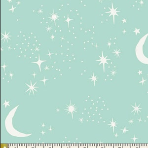 May include: A light blue fabric with a white repeating pattern of stars and crescent moons. The fabric is 8 inches wide.
