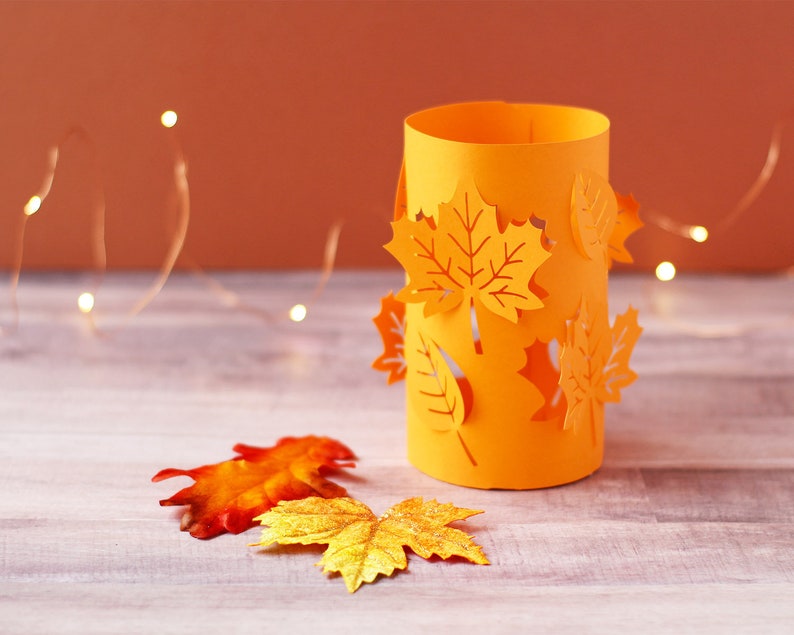 A cylindrical-shaped paper lantern for Thanksgiving.