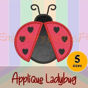 May include: Red and black applique ladybug with five black hearts on each wing. The ladybug is outlined in black thread. Applique Ladybug.