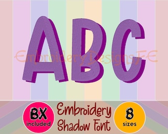 May include: Purple embroidered letters spelling "ABC" with a shadow effect. The image includes the text "Embroidery Shadow Font" and icons indicating "BX included" and "8 sizes". The background has vertical stripes of various pastel colors.