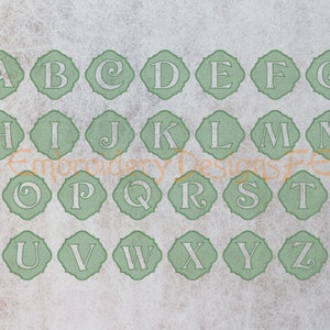 May include: A set of 26 alphabet letters in a green and white color scheme. Each letter is in a decorative, ornate frame. The letters are in a traditional font style.