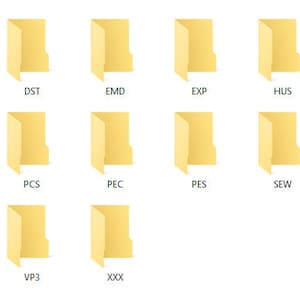 May include: A computer screen displaying a list of folders with names like CSD, DST, EMD, EXP, HUS, JEF, JEF+, PCS, PEC, PES, SEW, SHV, VIP, VP3, and XXX.