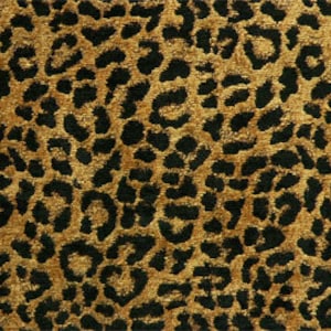 May include: A brown and black leopard print rug with a soft, plush texture.