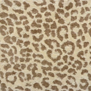May include: Beige fabric with a brown leopard print pattern.