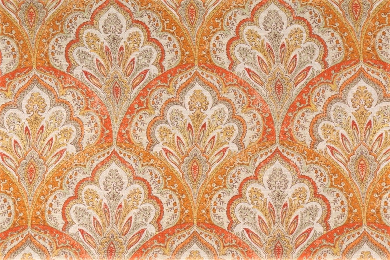 May include: A repeating pattern of orange, yellow, and gray paisley designs on a white background. The pattern is intricate and detailed, with a traditional paisley motif.