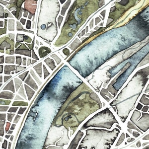 May include: A watercolor painting of a city map with a river running through it. The map is in shades of gray, brown, and green, with a blue river. The city streets are outlined in white.