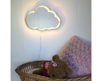 Bright white wooden cloud with colorful back.