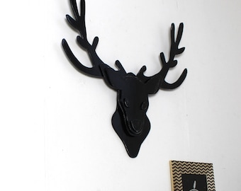 trophy black weathered wood deer head