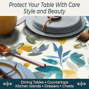 May include: A floral patterned table protector with blue, yellow, and green watercolor leaves. The image includes a copper spoon, plates, and text that reads "Protect Your Table With Care Style and Beauty" and "Dining Tables * Countertops Kitchen Islands * Dressers * Chests."