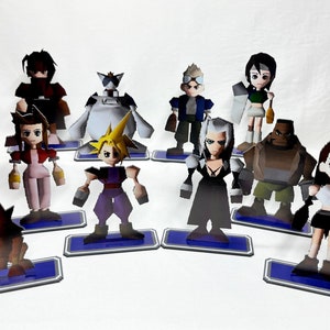 May include: A set of ten collectible figurines of characters from the Final Fantasy VII video game. The figurines are made of paper and are painted in various colors. The characters include Cloud, Tifa, Aeris, Sephiroth, Barret, Red XIII, Yuffie, Cid, Vincent, and Zack.