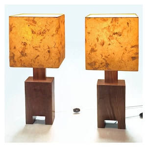 Modern bedside table lamp, walnut base, mango orange paper shade, single cost 165 EACH, choice of shades if you inquire.