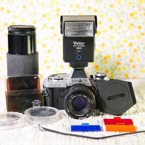 Minolta X-370 SLR with Two Lenses, Flash, Camera Bag and Extras. #SLR10