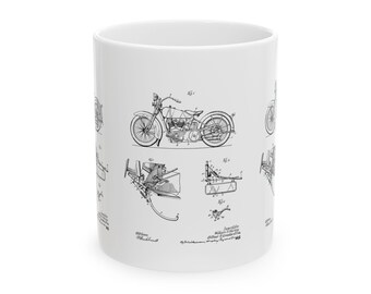 May include: A white ceramic mug with a black and white illustration of a motorcycle patent drawing. The patent drawing includes the text "Invention of William S. Harley and Arthur Davidson,  Motor Cycle,  Application filed May 22, 1909.  Patented August 23, 1910."