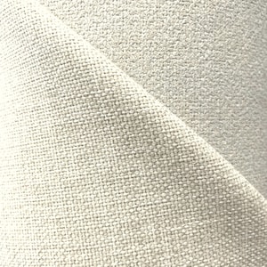 Pode incluir: Close-up de um tecido de linho natural com uma textura subtil. O tecido é de cor bege claro.