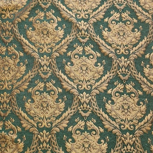 May include: A fabric featuring a deep forest green background with an intricate, repeating damask pattern in metallic gold. The design consists of symmetrical, ornate floral and leaf motifs woven into the textile, creating a textured appearance.