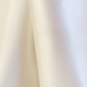 Blackout Ivory 100% with facing satin finish FR 54&quot;