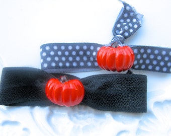 Elástico de cabelo em formato de abóbora de Halloween, estilo Jack O' Lantern.