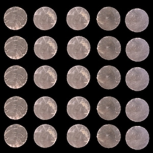 May include: A grid of 36 round, iridescent, mother-of-pearl shell tiles. The tiles are arranged in a square pattern on a black background.