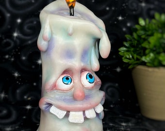 Funny cute with 4 teeth glowing in the dark aqua blue candle OOAK polymer clay sculpture with a glass flame handmade hand painted