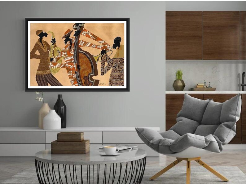 May include: A framed artwork depicting a jazz band. The musicians are rendered in silhouette with detailed patterns on their clothing. Instruments include a saxophone, double bass, trumpet, and a drum. The color palette is warm, with browns and tans dominating the scene.