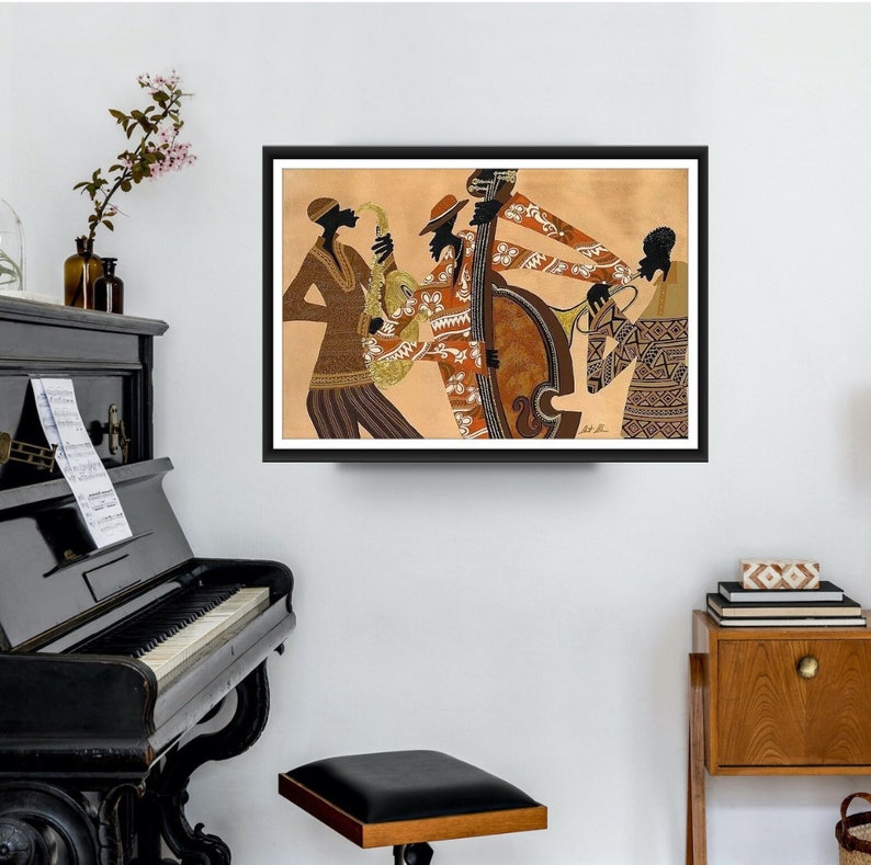 May include: Framed art print depicting a jazz band. The artwork features stylized figures playing a saxophone, double bass, trumpet, and other instruments. The musicians are dressed in patterned clothing, set against a tan background.