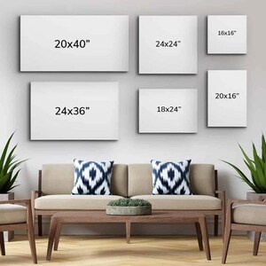 May include: A collection of six blank canvas art prints in various sizes, including 20x40 inches, 24x24 inches, 16x16 inches, 24x36 inches, 18x24 inches, and 20x16 inches. The prints are displayed above a modern living room setting.