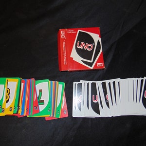 Tarjetas de juego Vintage UNO 1983 y almohadillas de puntuación de 1984 en caja original