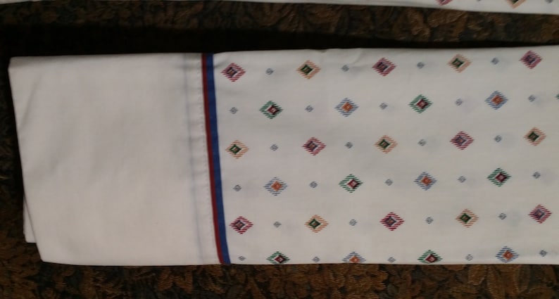with multi color bule designs. 2 pc set of standard size vintage pillow casse
