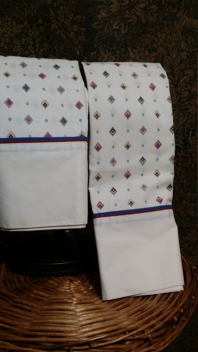 with multi color bule designs. 2 pc set of standard size vintage pillow casse