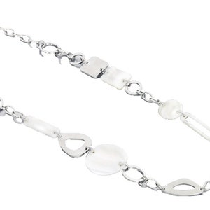 May include: A silver chain necklace with white shell and metal pendant charms.