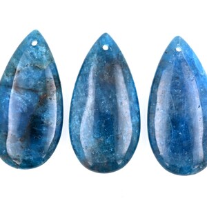 May include: Three teardrop-shaped blue gemstone pendants with a hole at the top for stringing.