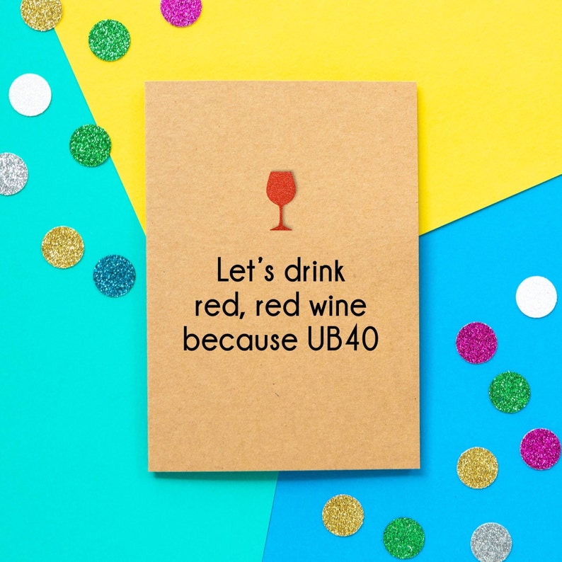 May include: A brown card with a red wine glass icon and the text "Let's drink red, red wine because UB40".