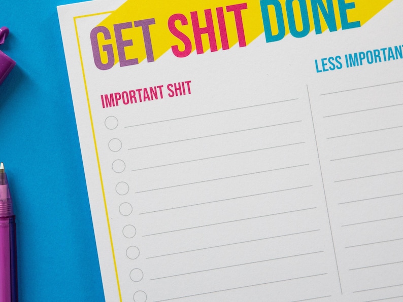 May include: A white printable to-do list with the text "GET SHIT DONE" in yellow, pink, and blue. The list is divided into two sections: "IMPORTANT SHIT" and "LESS IMPORTANT SHIT".