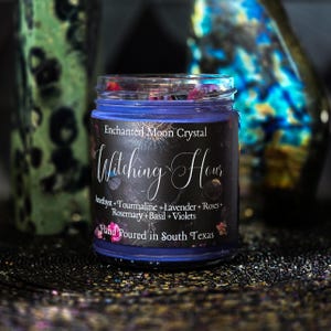 Witching Hour spiritual candle featuring black tourmaline, lavender, roses, rosemary, basil and violets in a deep purple handcrafted candle.