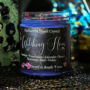 Witching Hour intention candle with deep purple wax, crystals, roses and ritual herbs, handcrafted for meditation, spiritual work and nighttime magic.