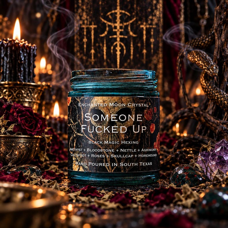 Someone Fucked Up intention candle in a turquoise glass jar displayed on a dark gothic altar featuring antique golden serpent decorations, glowing black taper candles, purple amethyst clusters, and deep crimson roses. Wisps of incense smoke drift through the warm amber lighting, creating a mysterious atmosphere for this handcrafted black magic hexing and banishment candle.