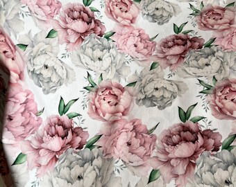 May include: A fabric with a repeating floral pattern of peonies in shades of pink, gray, and white. The flowers are detailed with green leaves against a white background. The fabric appears to be soft and possibly used for bedding or clothing.