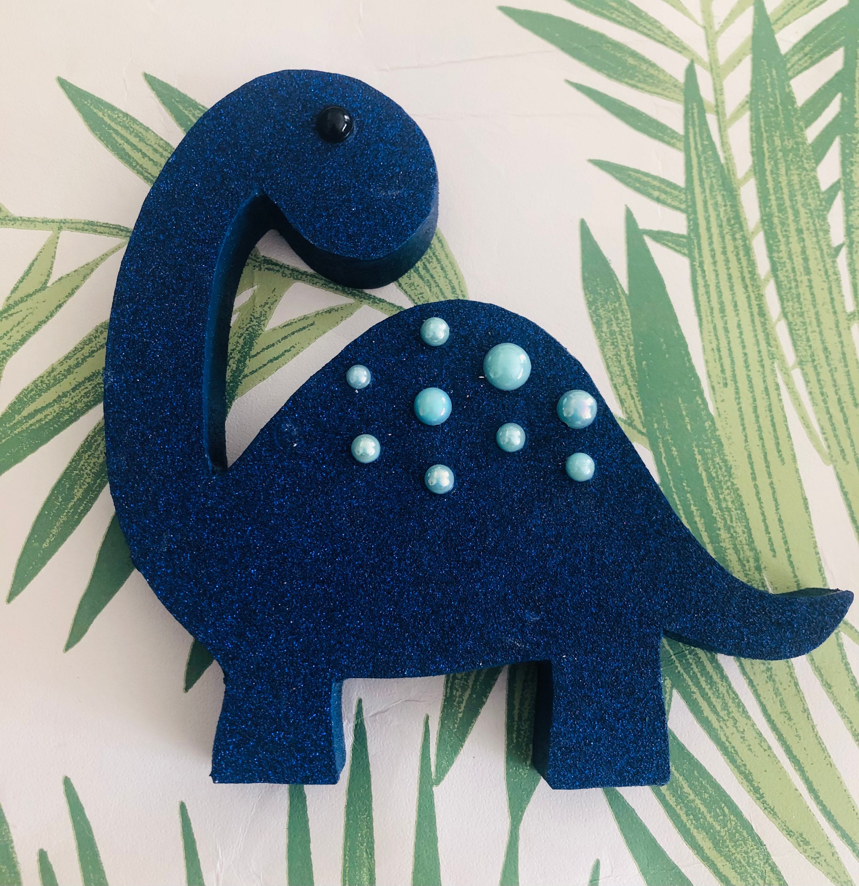 painted wooden dinosaur cutouts