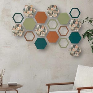 May include: A wall decor set featuring 14 hexagonal shaped wall tiles in various colors and patterns. The tiles are arranged in a honeycomb pattern and feature a variety of colors, including green, blue, brown, and white. The tiles are made of a durable material and are easy to hang.