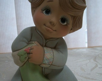 ceramic Christmas morning boy tot holding stocking