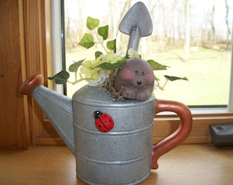 ceramic watering can with hedgehog
