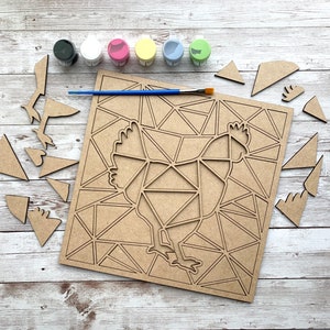 May include: A wooden craft kit featuring a geometric chicken design. The kit includes a wooden base, paint, and a brush. The pieces are ready to be painted and assembled.